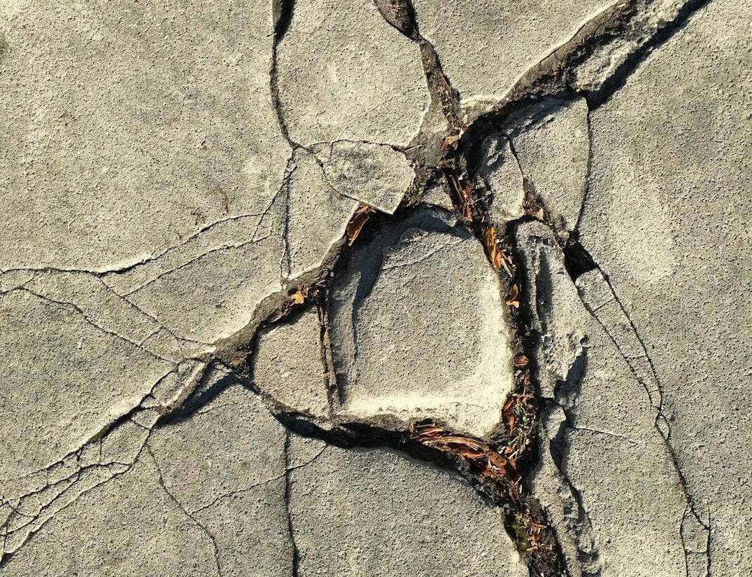close-up photo of broken concrete wall