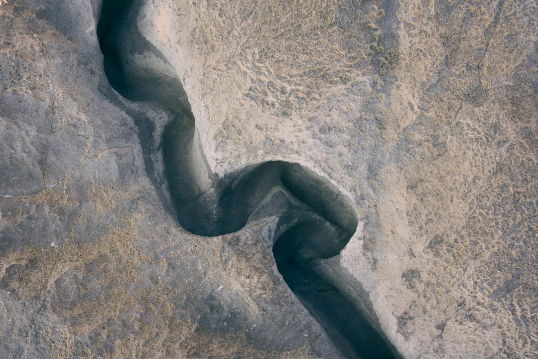 An aerial view of a river running through a desert