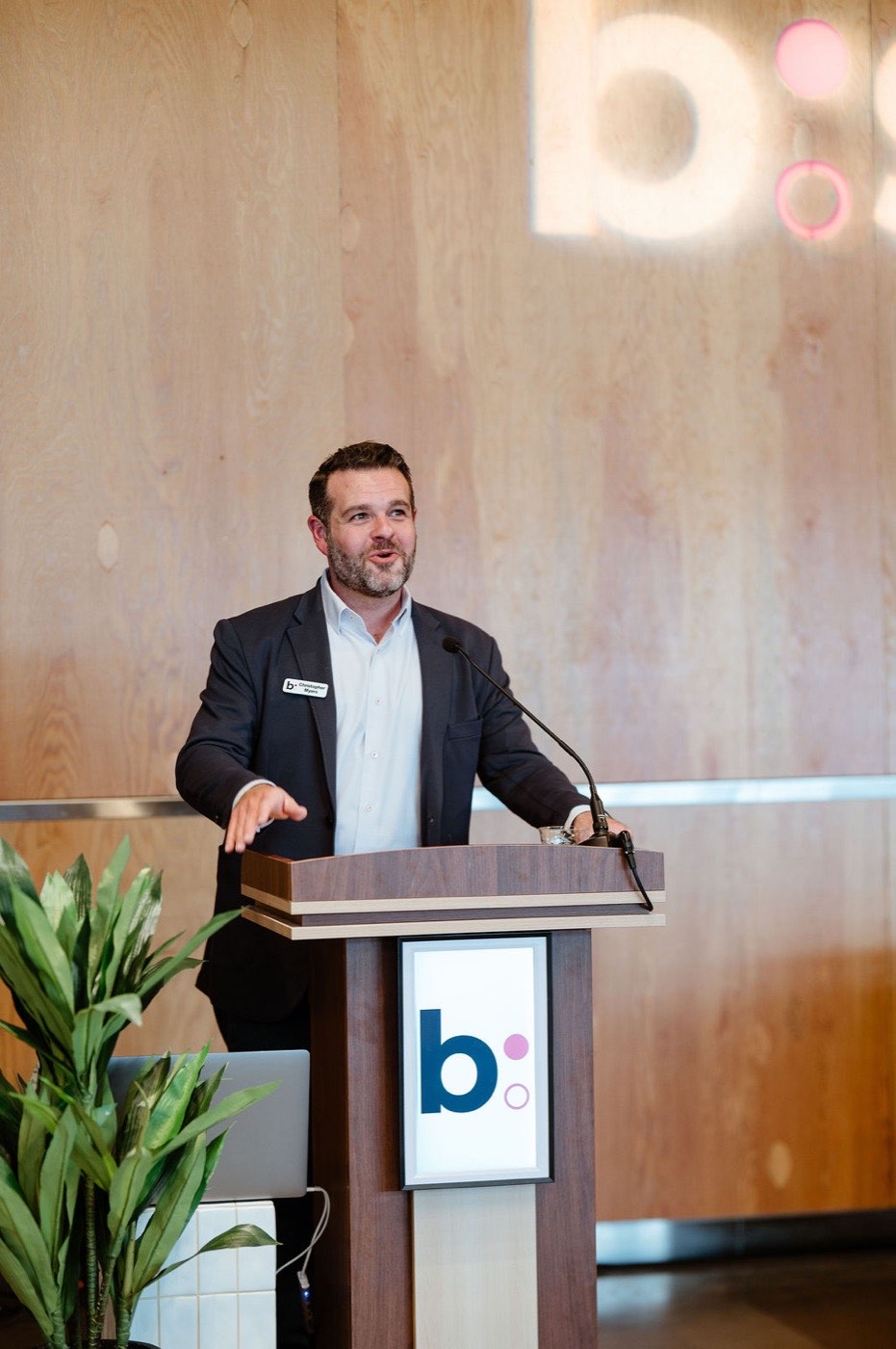 Chris Myers speaking at a podium